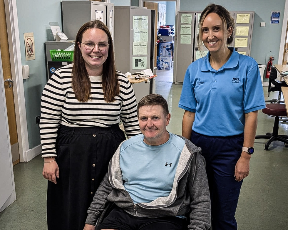Eve Young, patient Allan Campbell and occupational therapist Jennifer Cloughley together on the ward at the Queen Elizabeth University Hospital